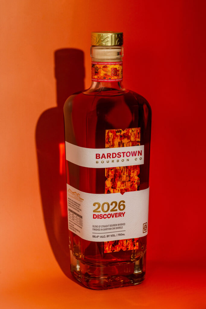 Bardstown Bourbon Company 2026 Discovery stands against orange gradient