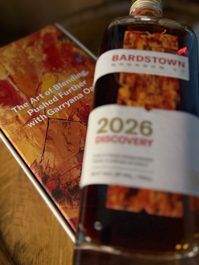 Bardstown Bourbon Company's Discovery 2026 blurred as it lies on art box