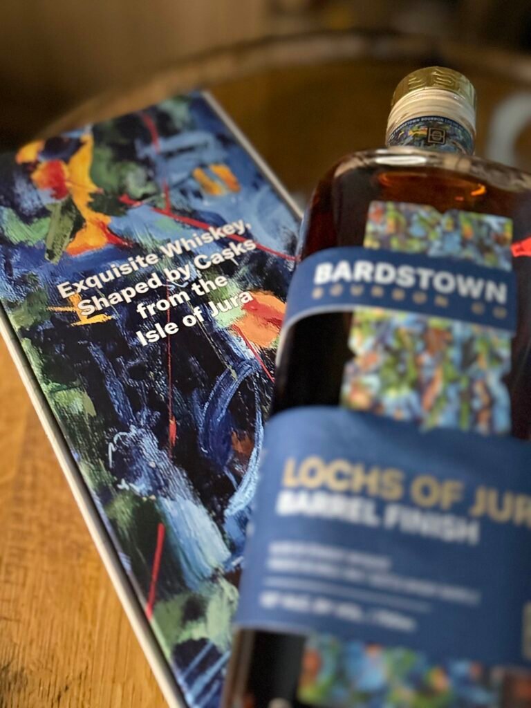 Bardstown Bourbon Company's Lochs of Jura blurred as it lies on art box