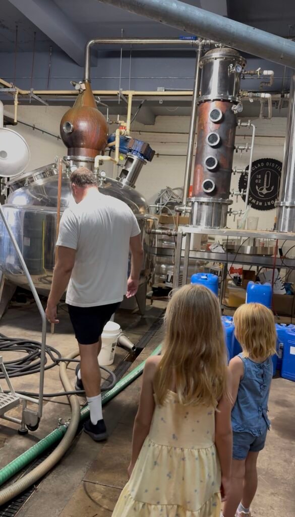 Owen leads the way, teaching the kids about the basics of distilling