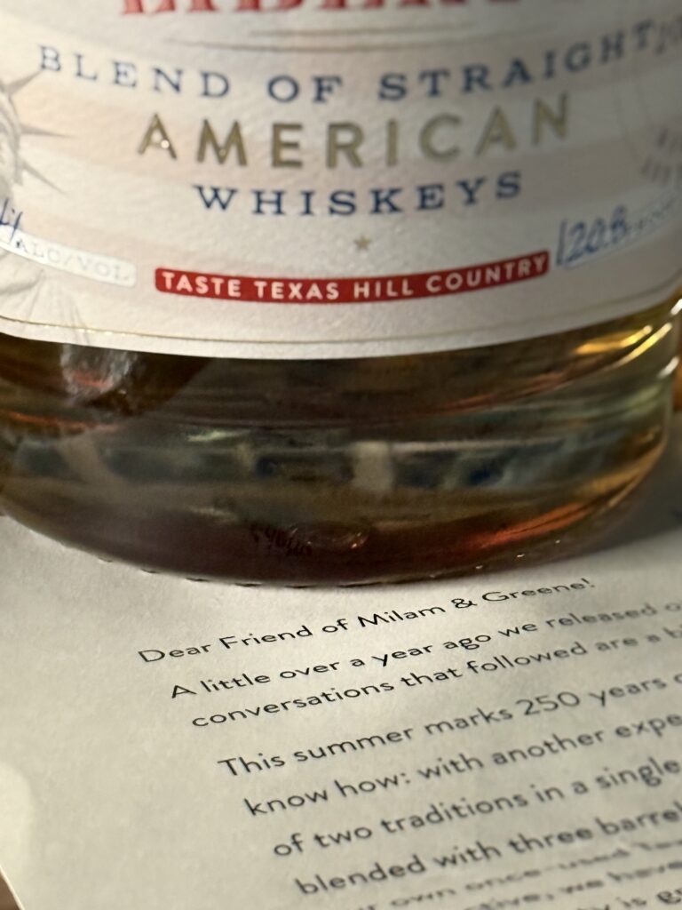 Milam & Greene's Liberty bottom label against letter