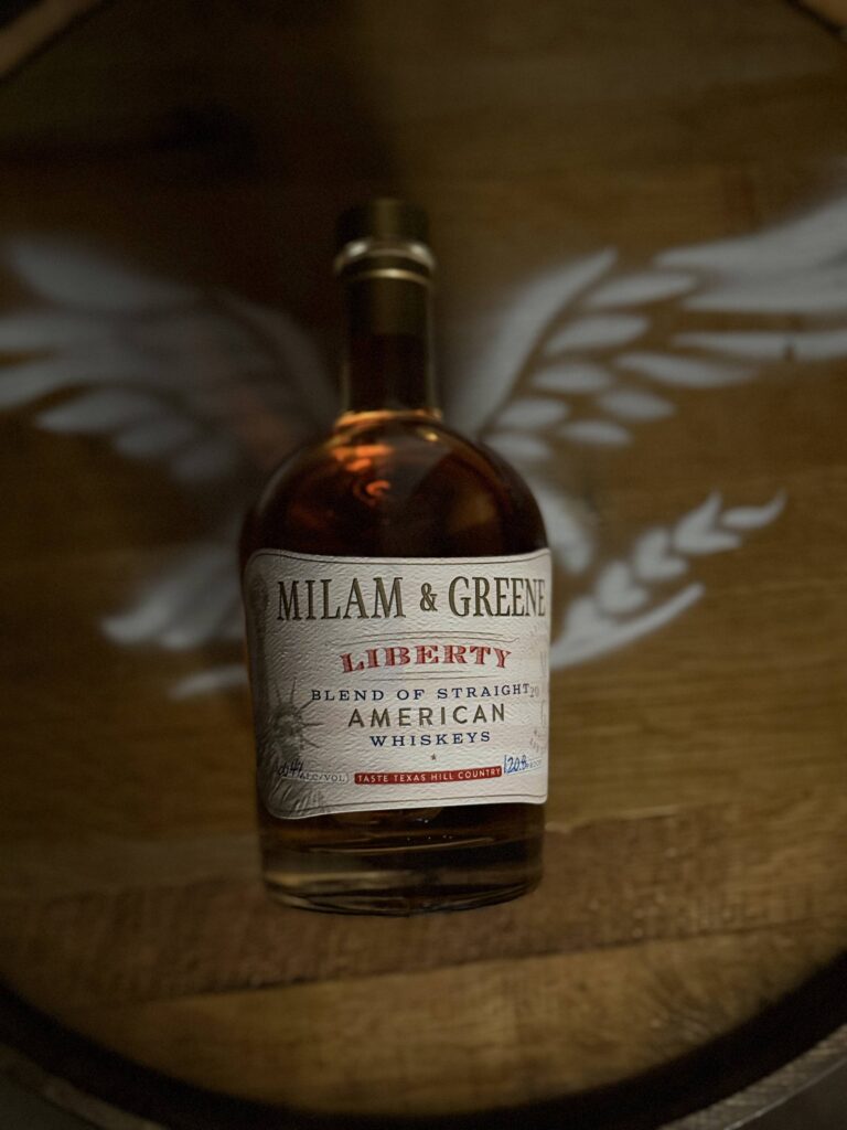 Milam & Greene's Liberty lies on top of Eagle whiskey barrel head logo