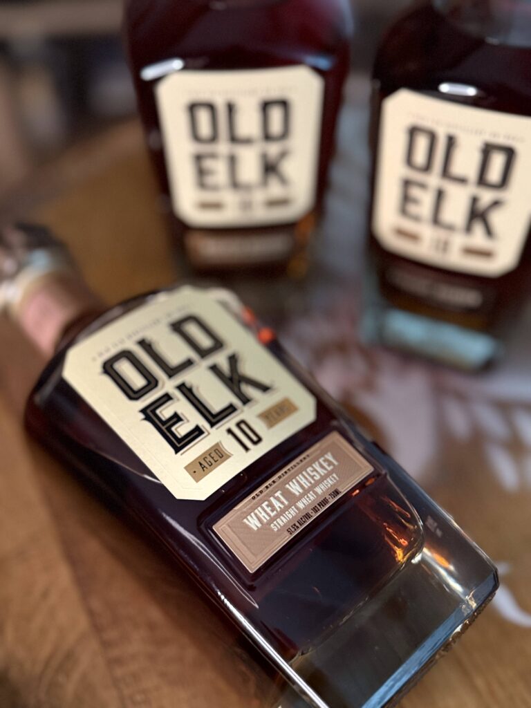 Old Elk 10-Year Wheat Whiskey lying beside the rest of the collection