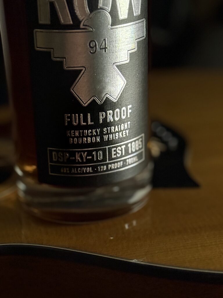 Row 94 Full Proof bottom label close-up on guitar