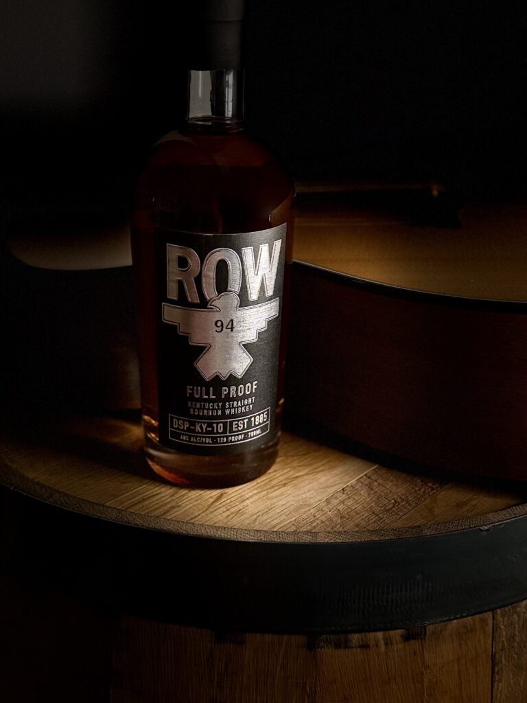 Row 94 Full Proof nestled in guitar crook