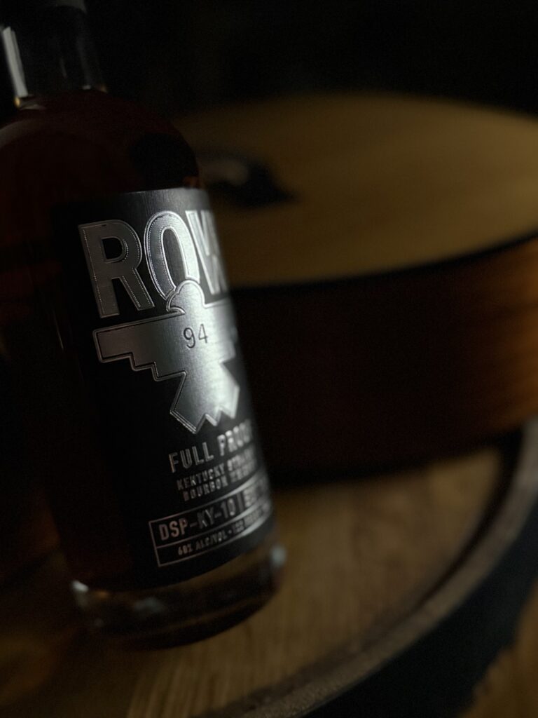 Row 94 Full Proof close-up against guitar crook