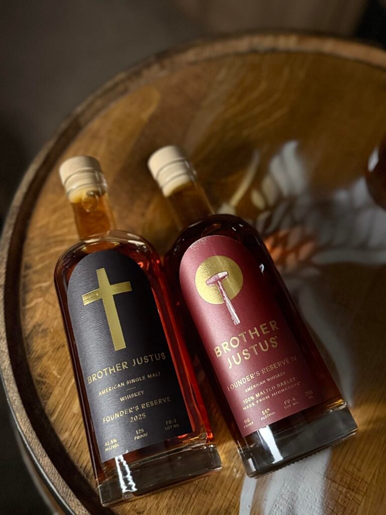 Brother Justus' Founder's Reserve IV lies beside 2025's Founder's Reserve lll on whiskey barrel head