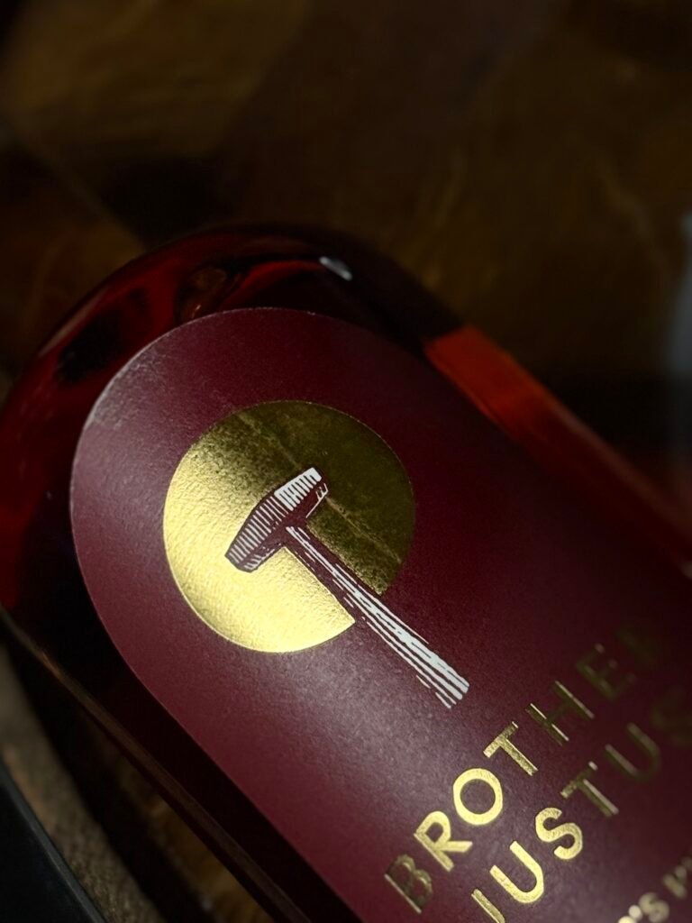 Brother Justus' Founder's Reserve IV close-up of upper label changed from cross to hammer