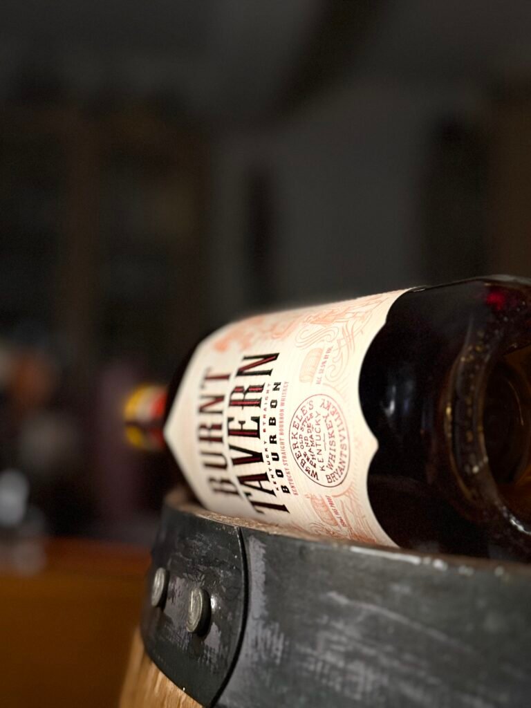 Burnt Tavern Double-Barreled bourbon lying on side with barrel ring visible