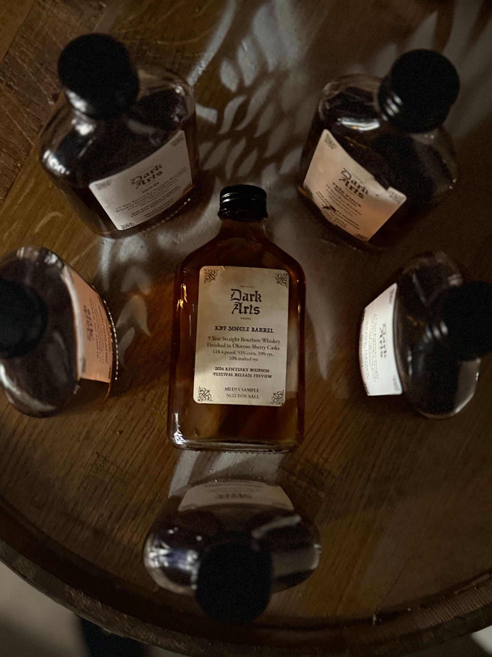 Dark Arts KBF Special Release: 9 Year Kentucky Bourbon Single Barrel finished in Oloroso Sherry barrels lies surrounded by a ritualistic circle of the other 5 releases