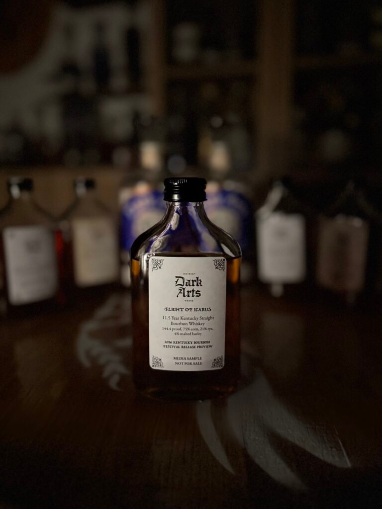 Dark Arts KBF Special Release: "Flight of Icarus" 11.5 Year Hazmat Kentucky Bourbon in front of other 5 releases & past finished bottles