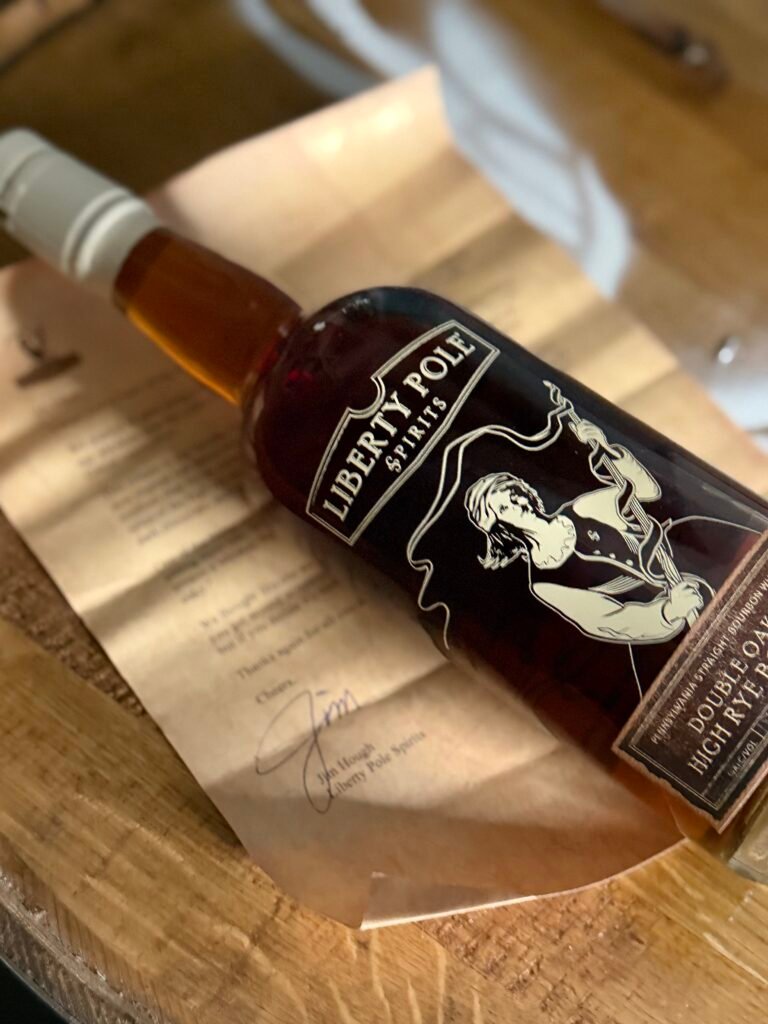 Liberty Pole Double Oaked High Rye Bourbon lying on vintage looking letter from owner Jim Hough