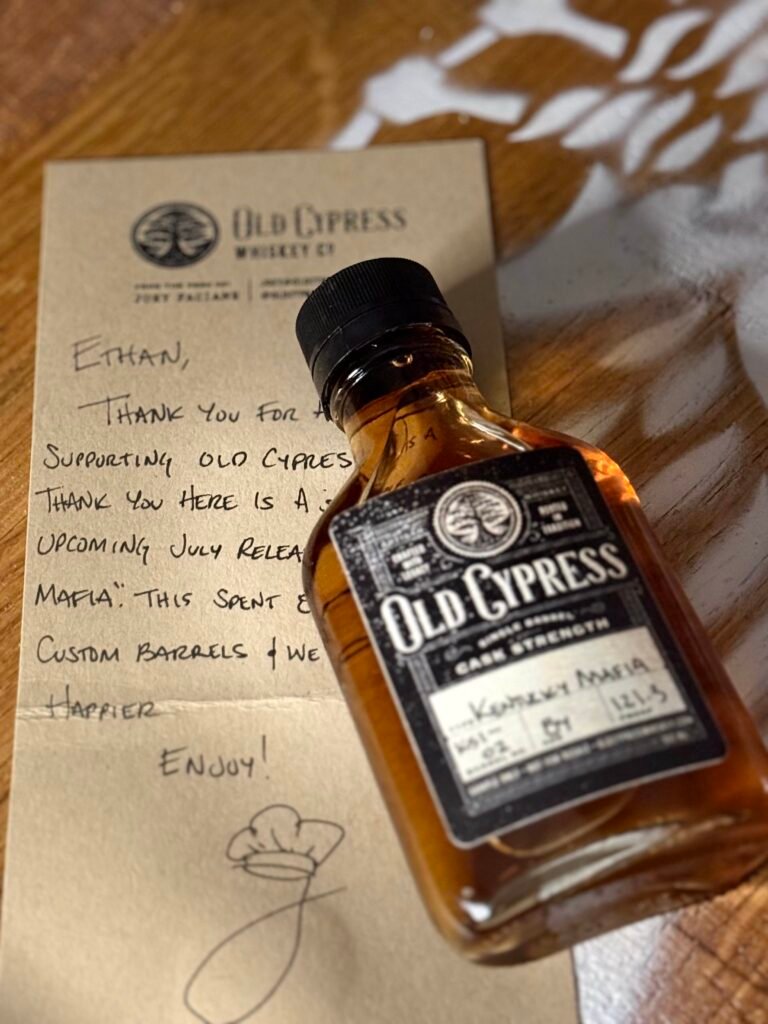 Old Cypress "Kentucky Mafia" Bourbon lying against hand written note
