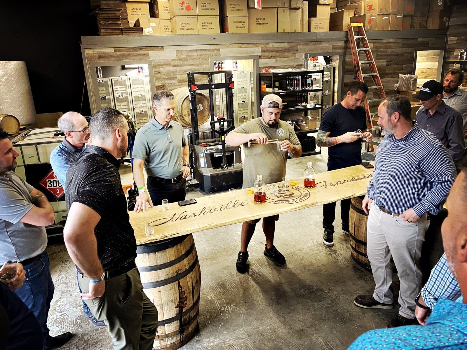 Ryan Teague, Master Blender & Sourcing Director of Southern Collective Spirits, pours for waiting crowd