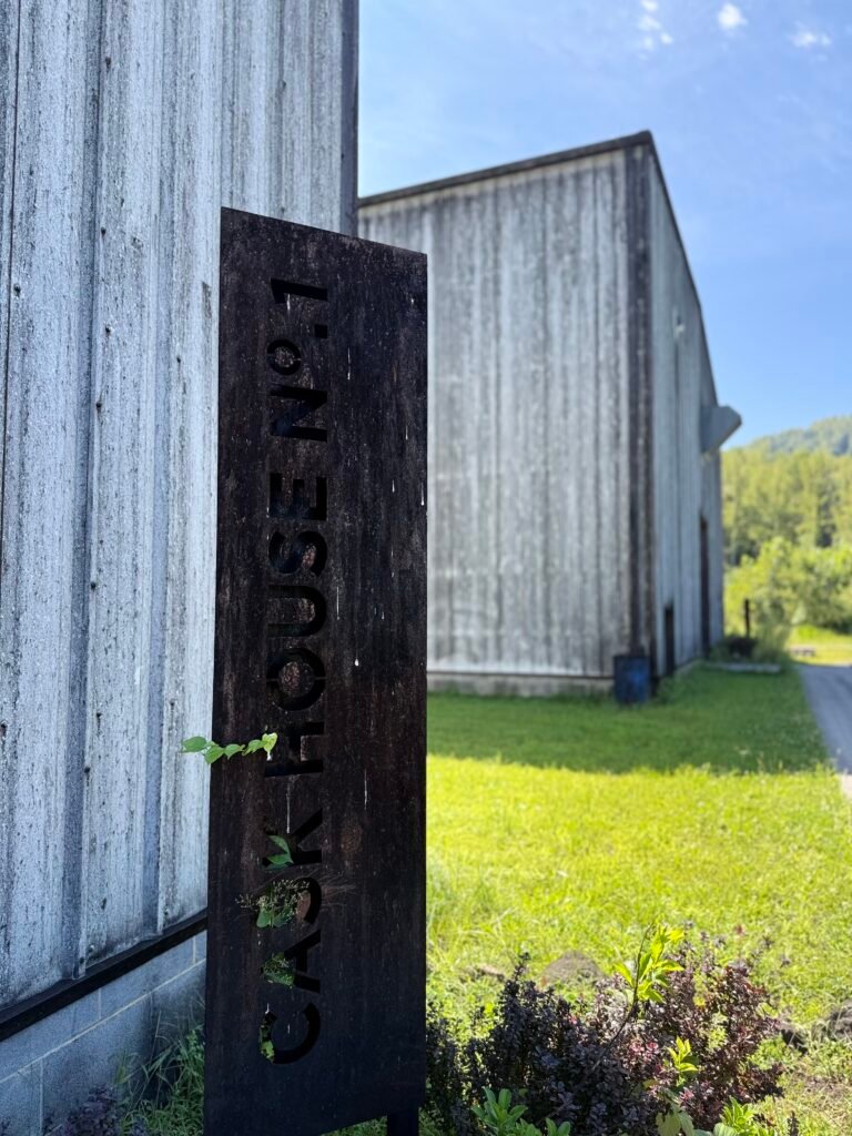 Sign marking Cask House #1 overgrowing with vines