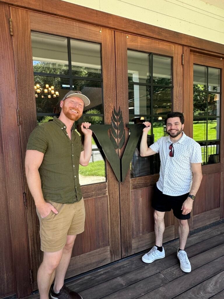 (Left to Right) Ethan Pope & David Aponte post in front of VDC front door.