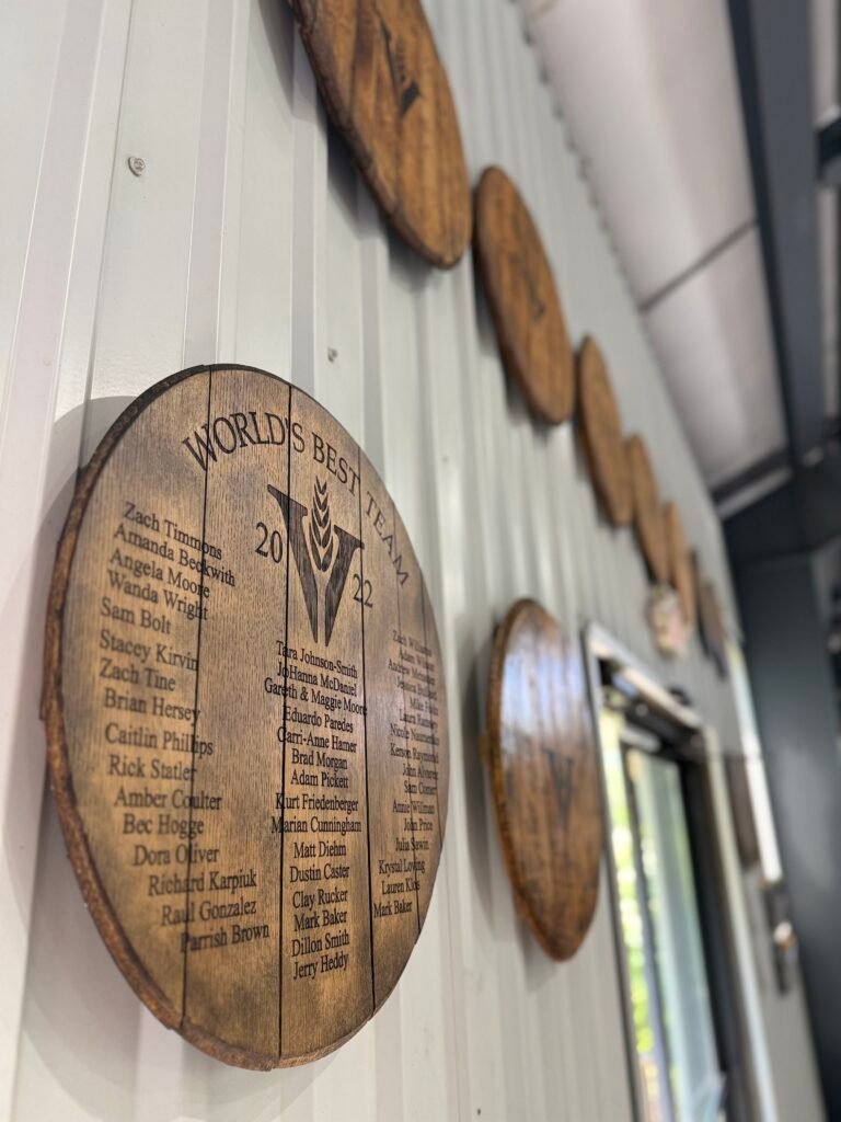 Each year, Amanda hand selects a special single barrel for the staff which they sign and receive a bottle of to say thank you for their hard work. The barrel heads are displayed on the exit from the still house