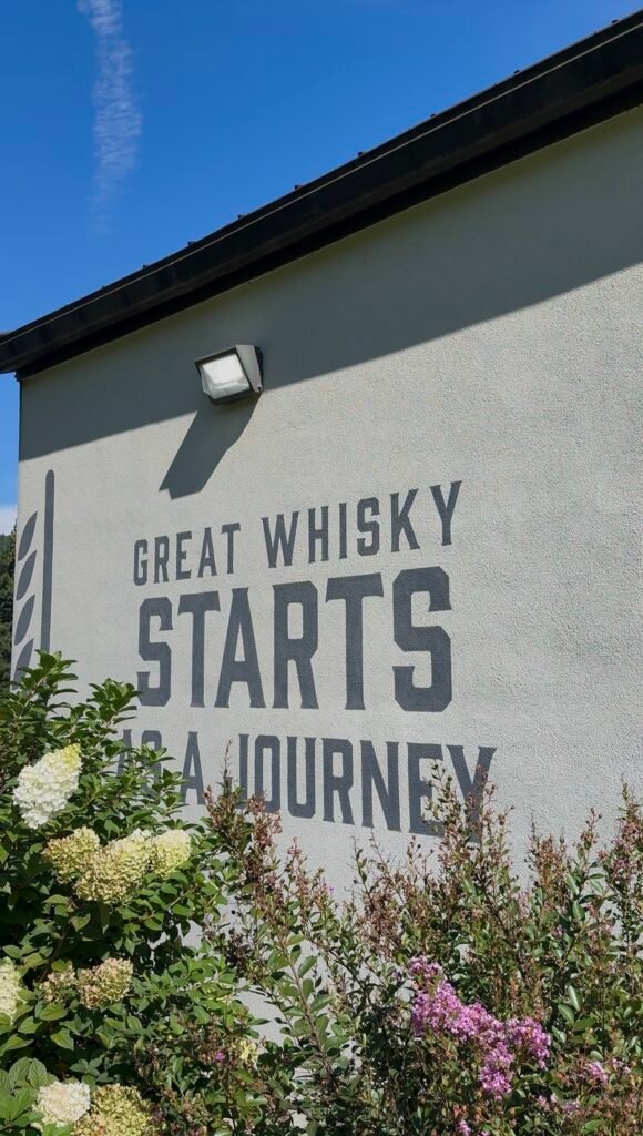 "Great Whiskey Starts as a Journey" quote on the side of VDC's still house