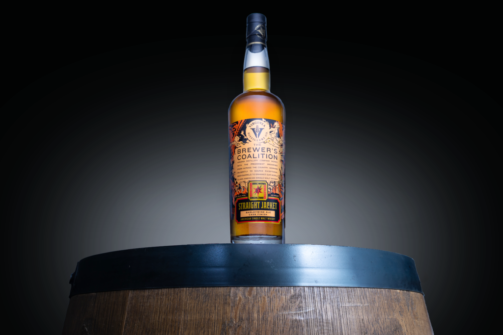 Virginia Distillery Co's newest Brewer's Coalition American single malt collaboration finished with Revolution Brewing's Straight Jacket barley-wine sitting amidst the dark