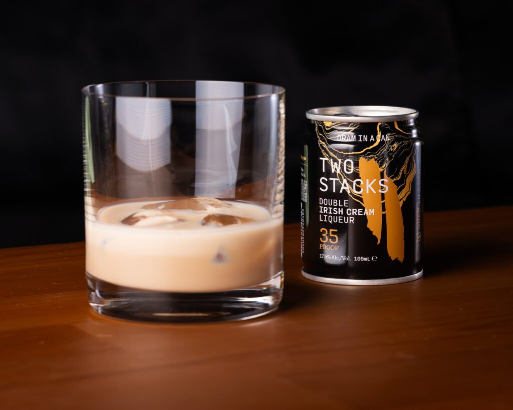 Two Stacks Double Irish Cream Liqueur Dram in a Can poured over ice in a rocks glass