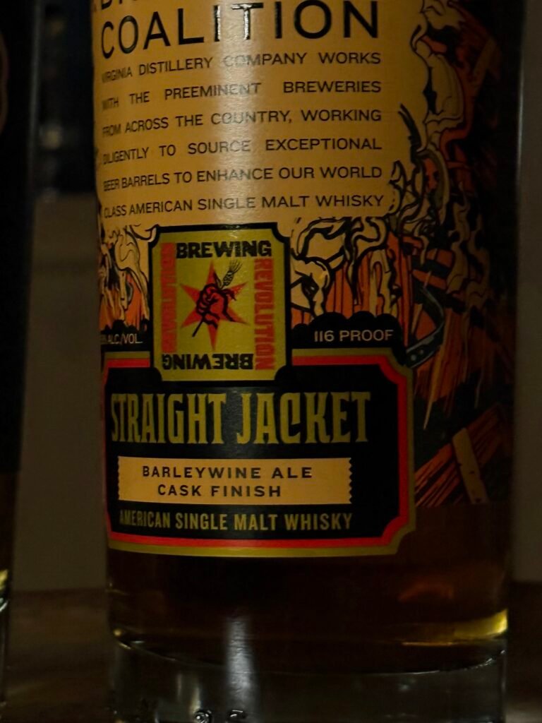 Darked close-up of bottom label of Virgina Distilling Co's "Straightjacket" barleywine finished American single malt