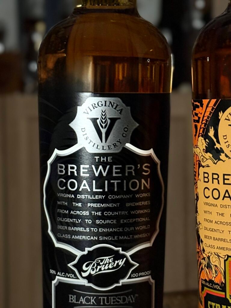 Virgina Distilling Co's "Black Tuesday" stout finished stands beside cropped barleywine finish release